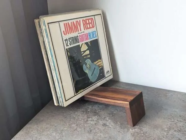 An elegant and stylish solid Black Walnut vinyl storage rack for either 12" LPs or 7" Singles that you'll love to have on display.