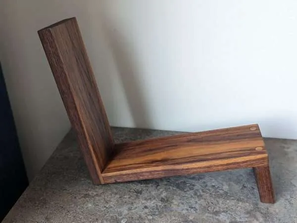 An elegant and stylish solid Black Walnut vinyl storage rack for either 12" LPs or 7" Singles that you'll love to have on display.