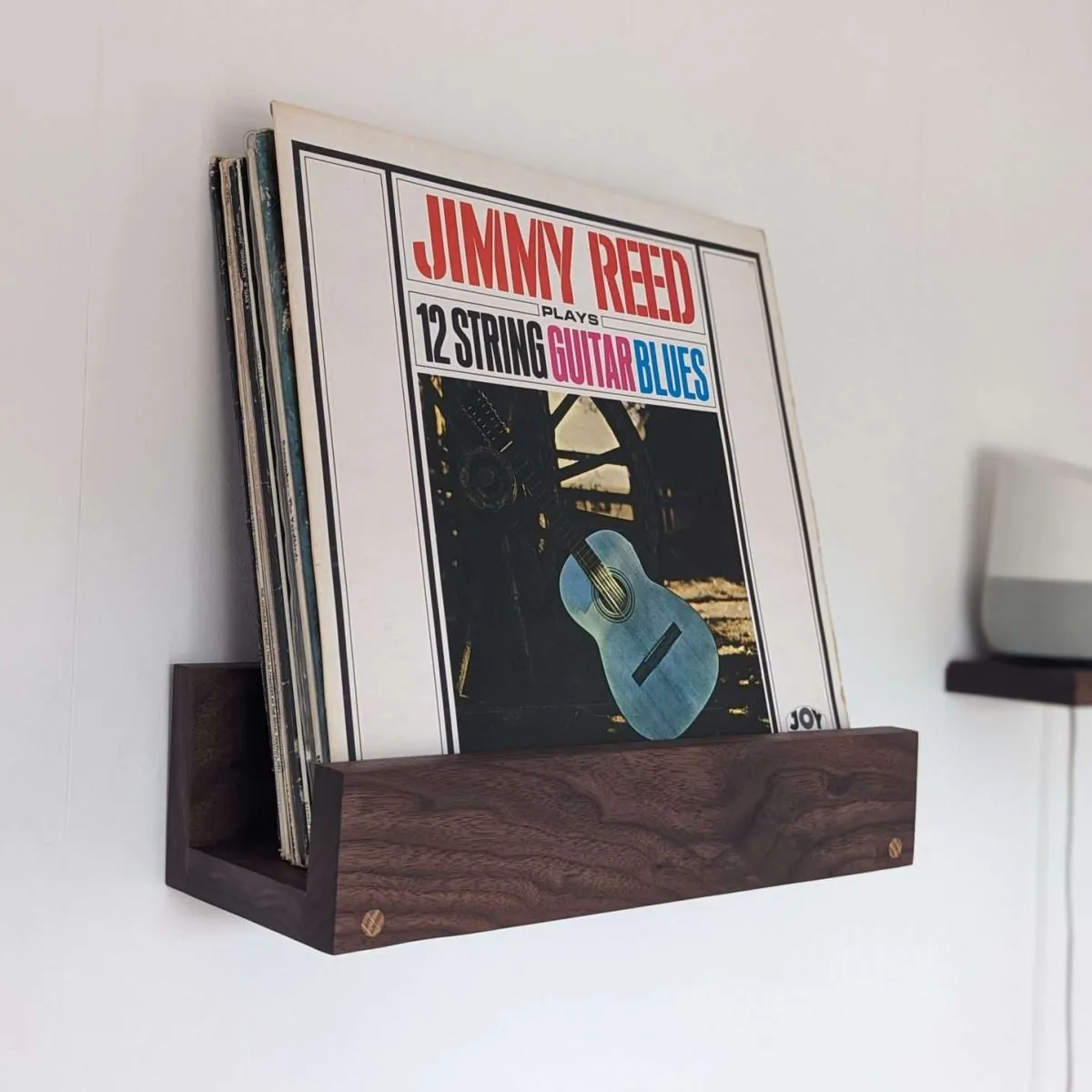 Black walnut wall mounted vinyl shelf