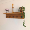 Solid Oak Coat Rack With Shelf - angled view with black hooks and ornaments