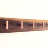 Modern Solid Black Walnut Coat Rack with Customizable Hooks - angled view copper hooks