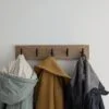 Oak coat rack with modern black hooks and 3 coats