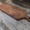 Solid Black Walnut Chopping Board - Angled image on kitchen side