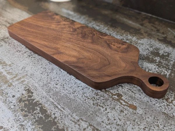 Solid Black Walnut Chopping Board - Angled image on kitchen side