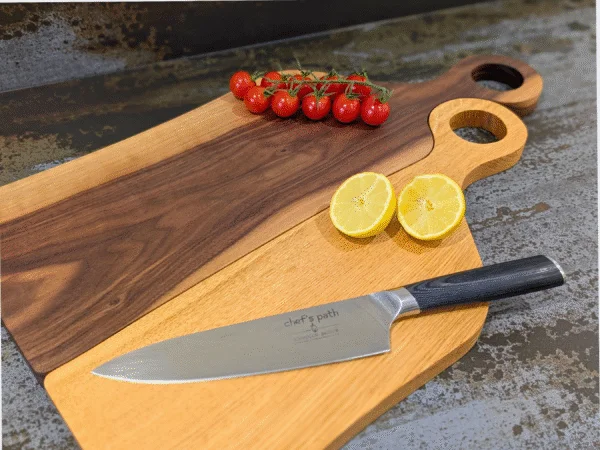 Oak Juliet and Black Walnut Romeo cutting board with knife, bowl and tomatoes