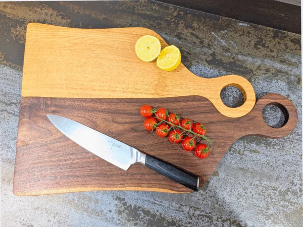 Oak Juliet and Black Walnut Romeo cutting board with knife, bowl and tomatoes