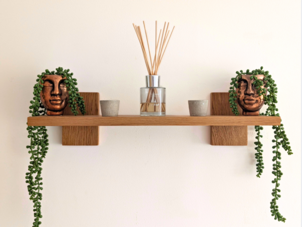 Modern Solid Oak Scandi Floating Shelf straight on image with ornaments