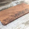 Solid Black Walnut Chopping Board - Angled image on kitchen side