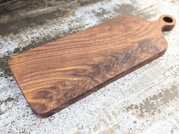 Solid Black Walnut Chopping Board - Angled image on kitchen side