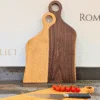 labelled Romeo & Juliet serving boards stood up in kitchen