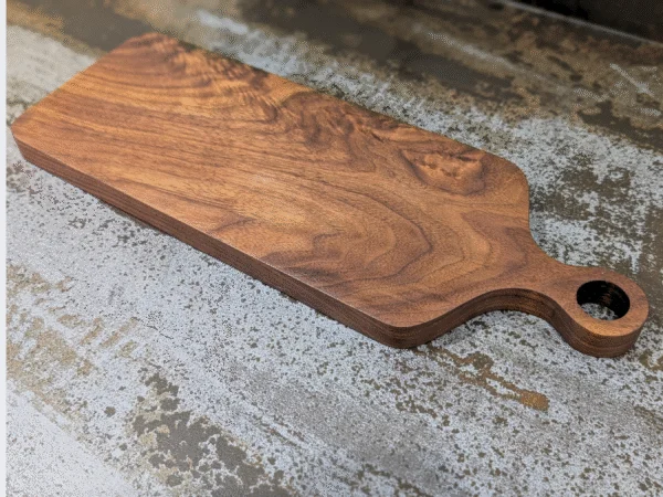 Solid Black Walnut Chopping Board - Angled image on kitchen side