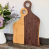 Romeo & Juliet serving boards stood up in kitchen next to flowers