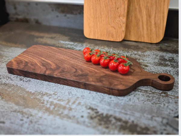 Solid Black Walnut Chopping Board - Angled image with tomatoes
