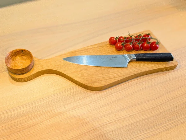 Oak Juliet cutting board with knife, bowl and tomatoes
