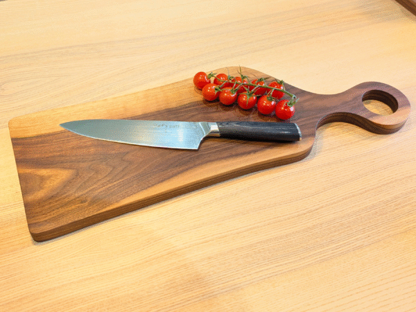 Black Walnut Romeo cutting board with knife, bowl and tomatoes