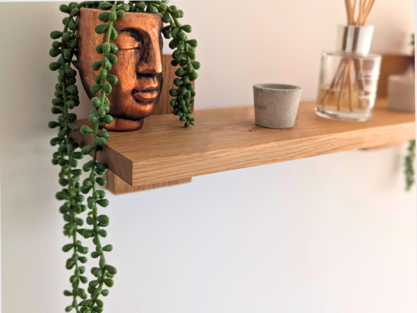 Modern Solid Oak Scandi Floating Shelf close up angled image with ornaments
