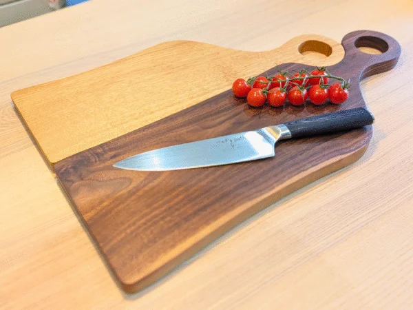 Oak Juliet and Black Walnut Romeo cutting board with knife, bowl and tomatoes