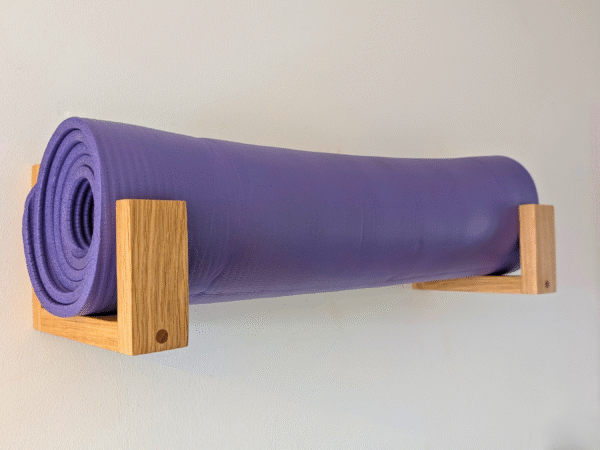Solid Oak yoga mat hooks - wall mounted far apart, angled image
