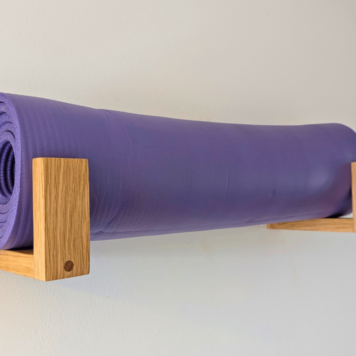 Solid Oak yoga mat hooks - wall mounted far apart, angled image