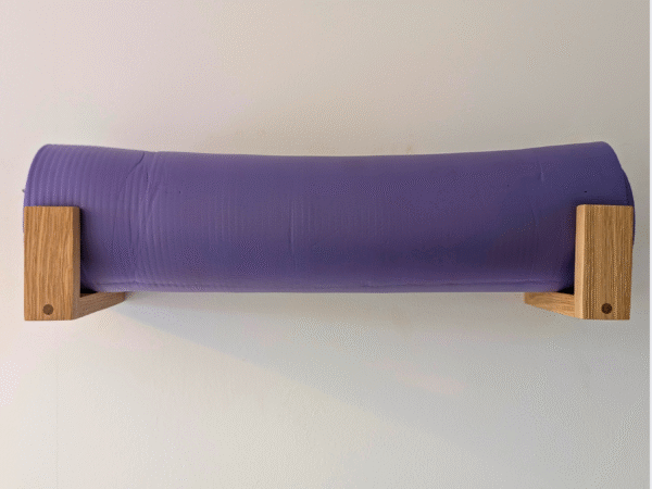 Solid Oak yoga mat hooks - wall mounted far apart, straight on view