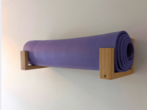 Solid Oak yoga mat hooks - wall mounted far apart, angled image