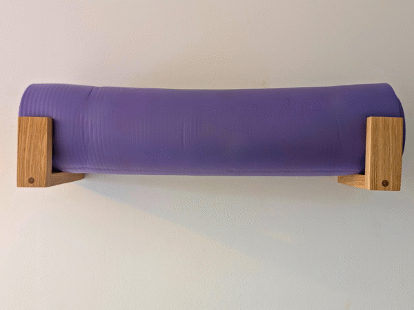 Solid Oak yoga mat hooks - wall mounted far apart, straight on view