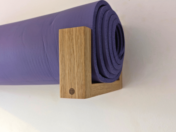 Solid Oak yoga mat hooks - wall mounted close up view