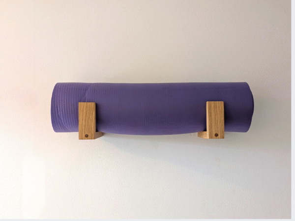 Solid Oak yoga mat hooks - wall mounted close together with mat overhanging