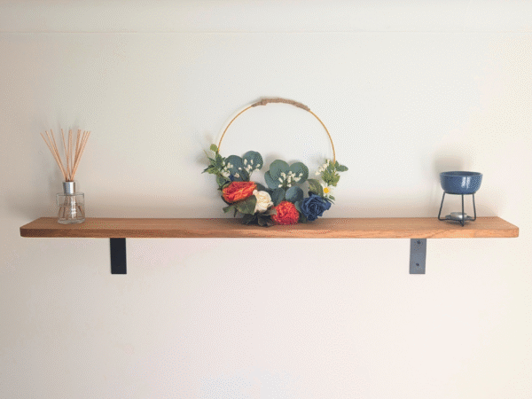 Wall mounted Oak shelf with rounded corners and cast iron brackets