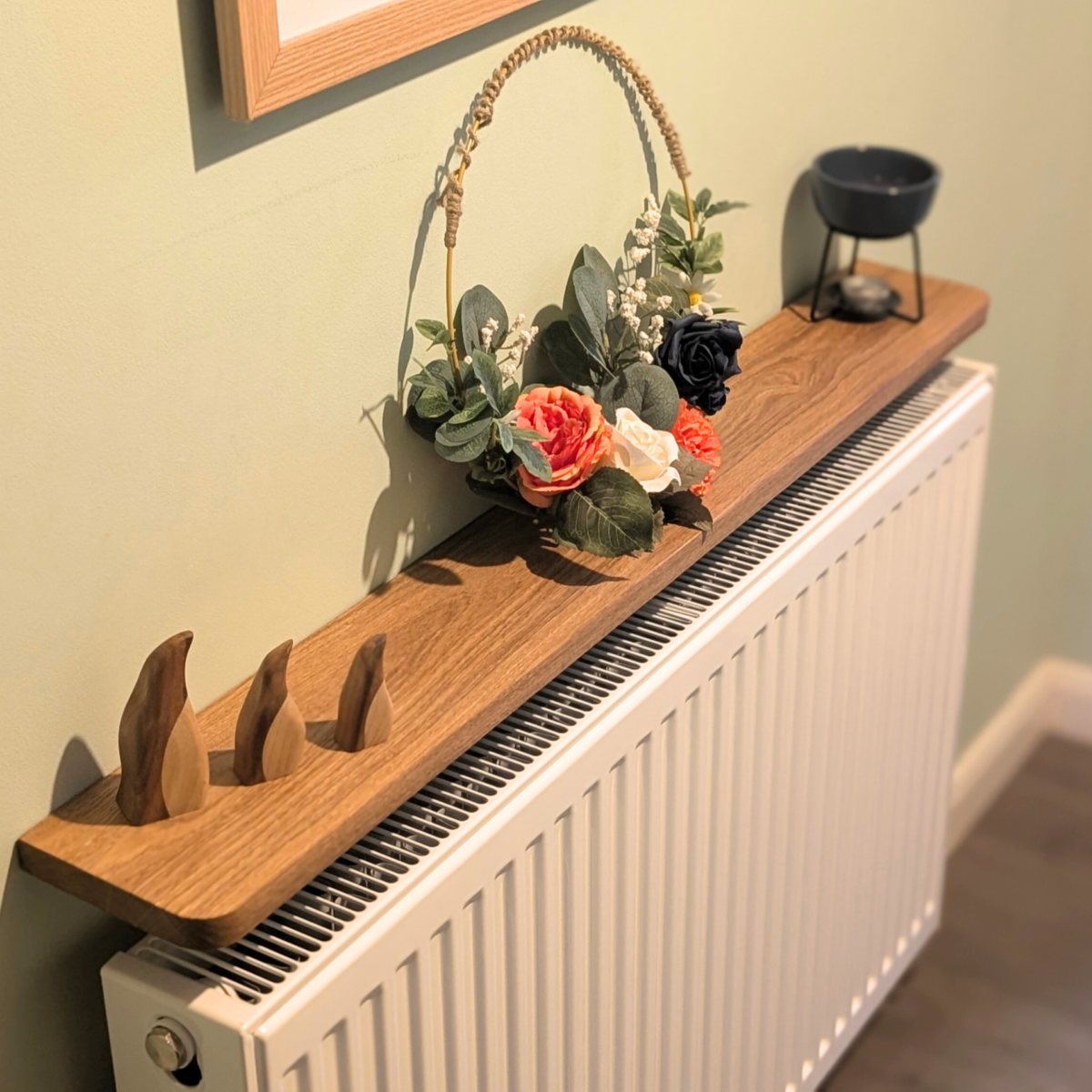 110cm Easy fit oak shelf with ornaments - angled image