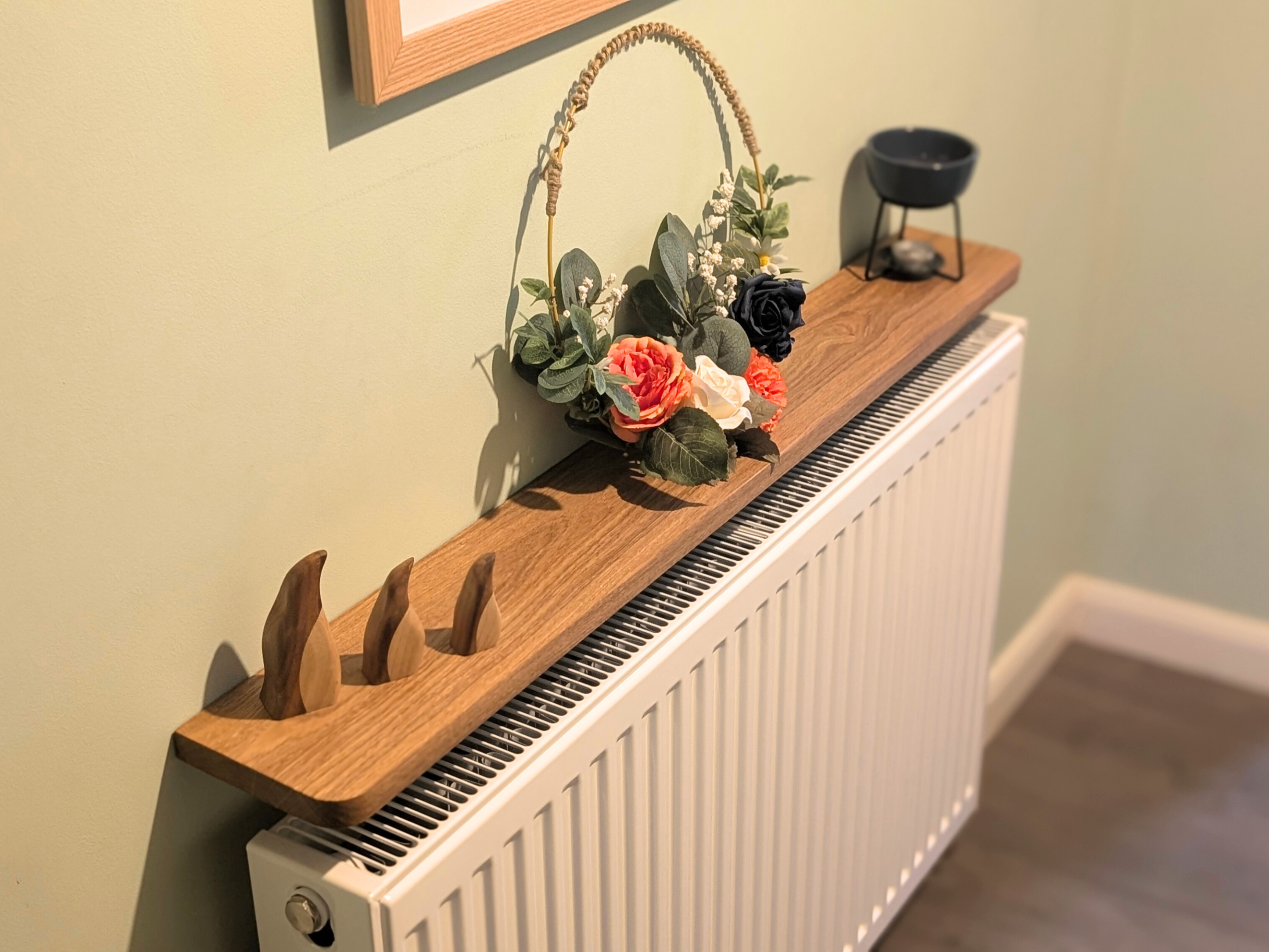 110cm Easy fit oak shelf with ornaments - angled image