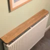 110cm no drill oak radiator shelf - angled image
