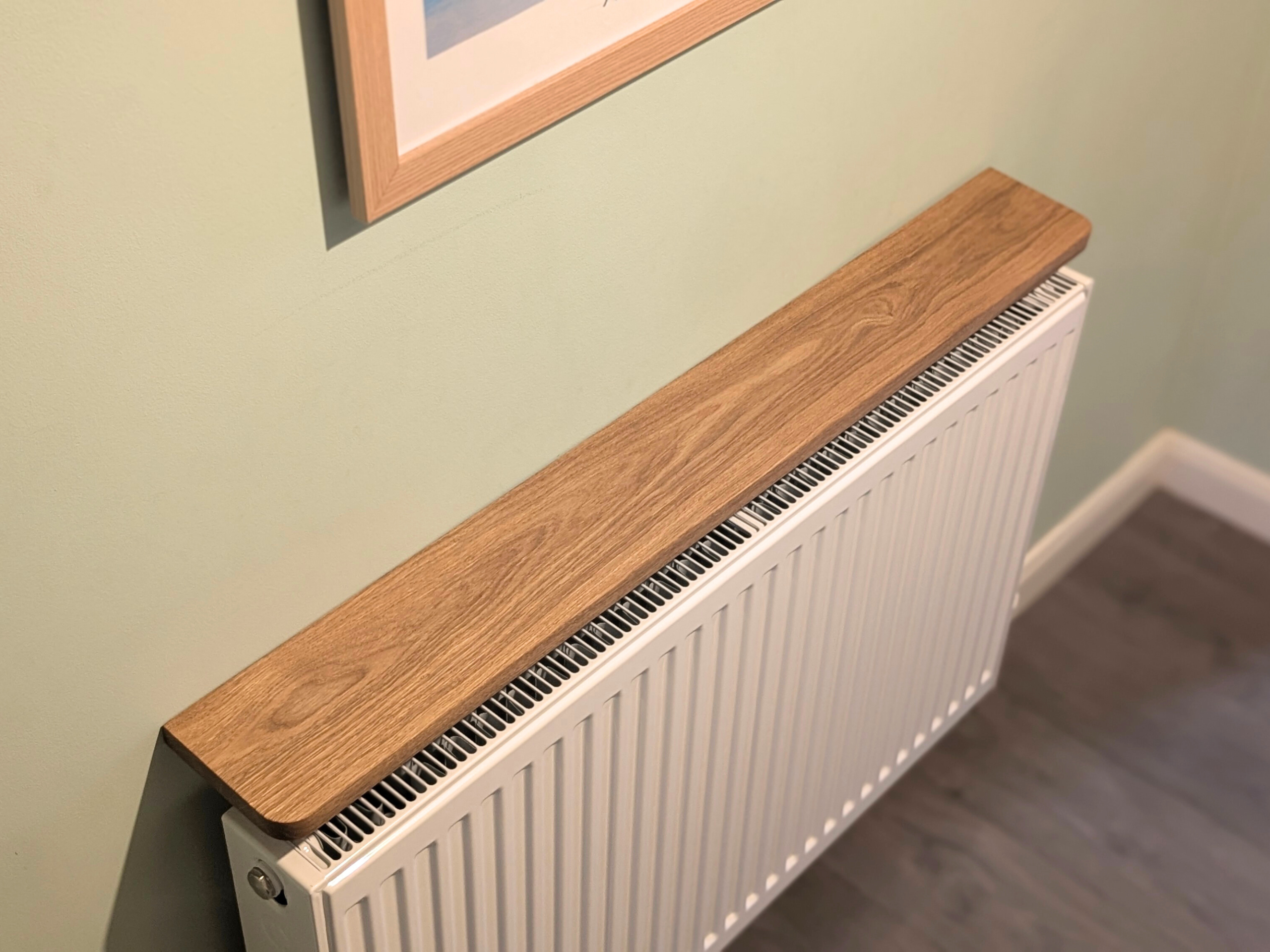 110cm no drill oak radiator shelf - angled image