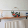 Oak radiator shelf with cast iron brackets