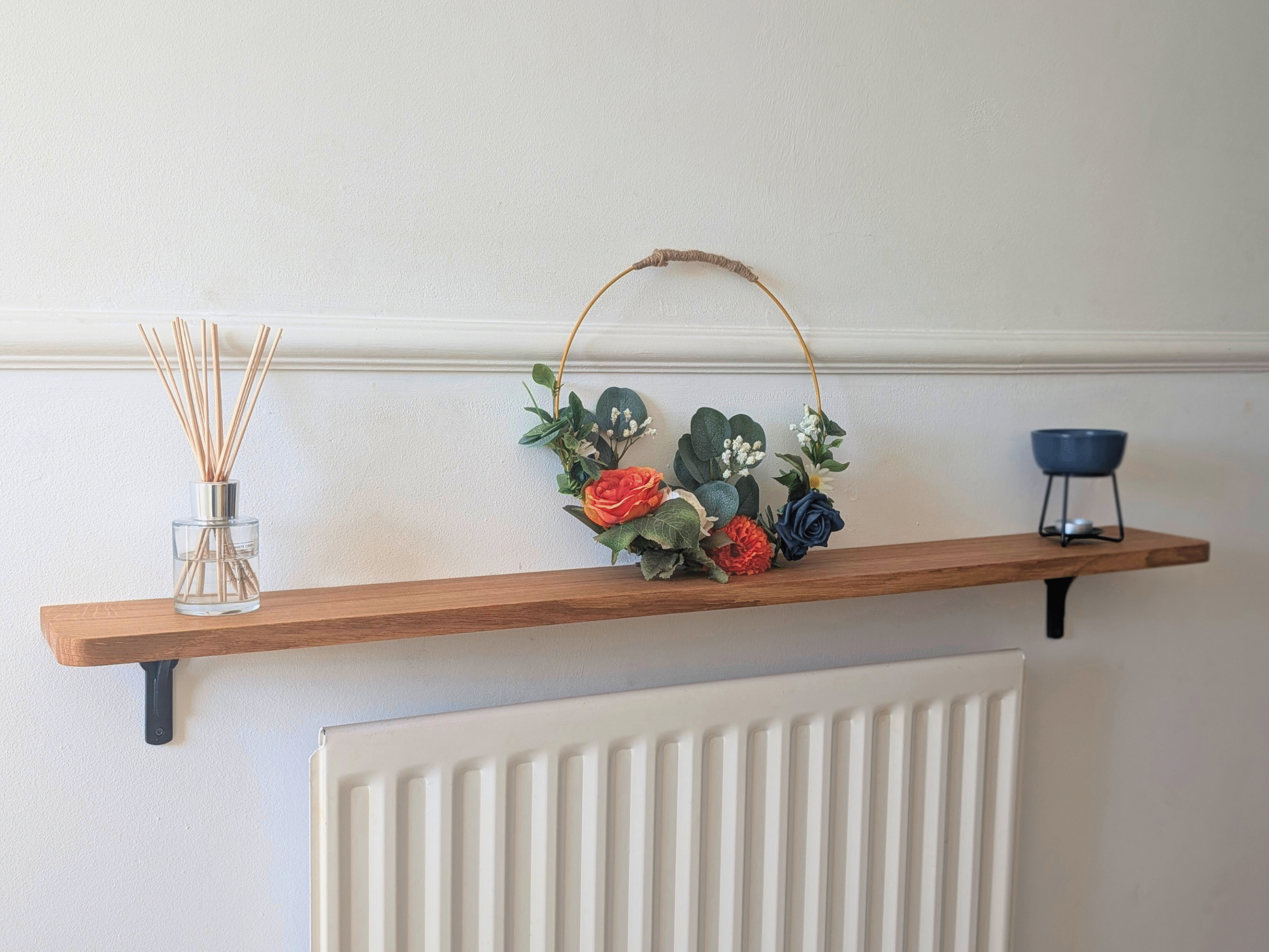Oak radiator shelf with cast iron brackets