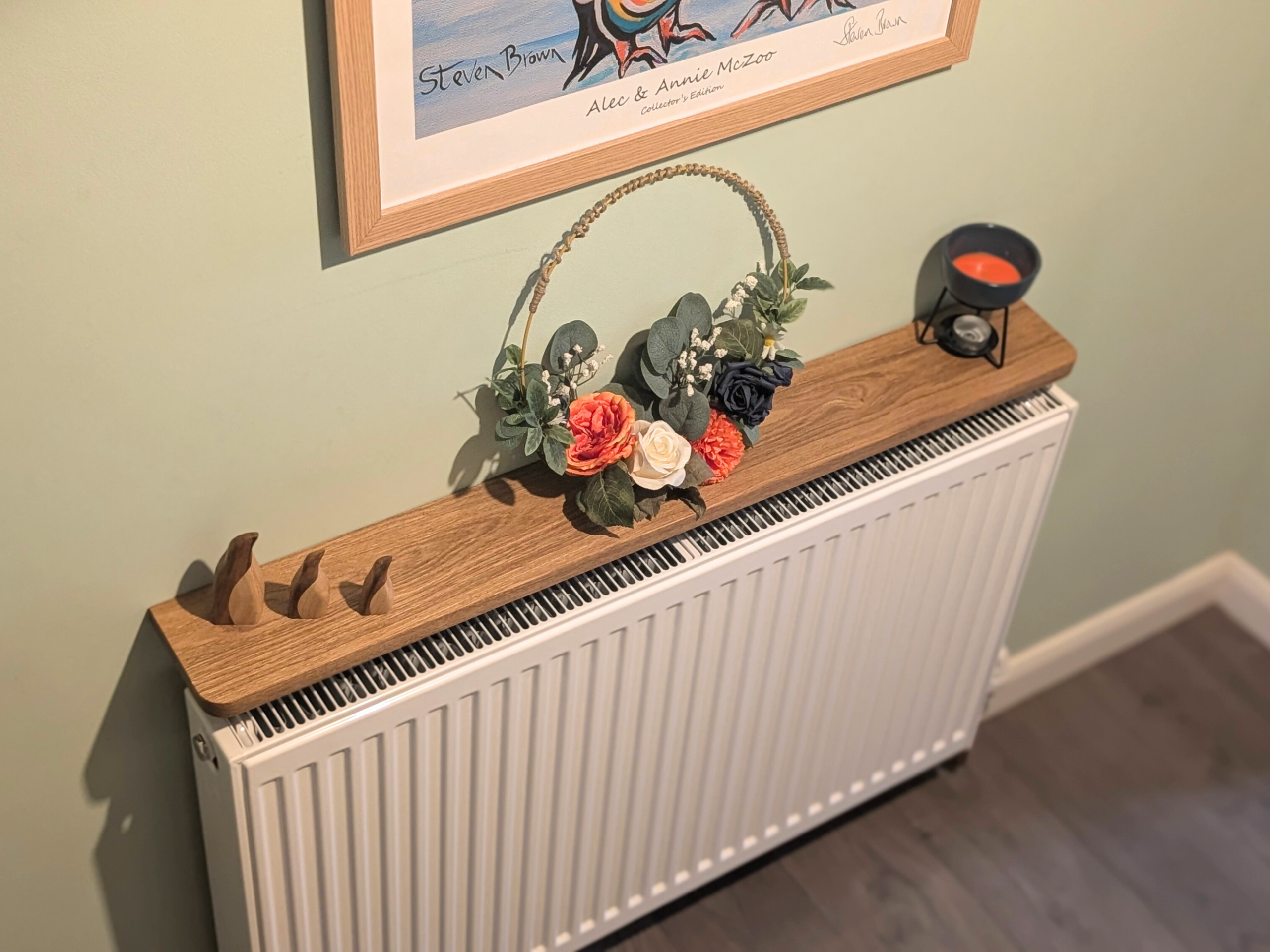 110cm no drill oak radiator shelf with ornaments - angled image
