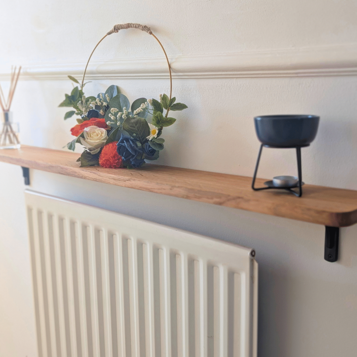 Oak radiator shelf with cast iron brackets