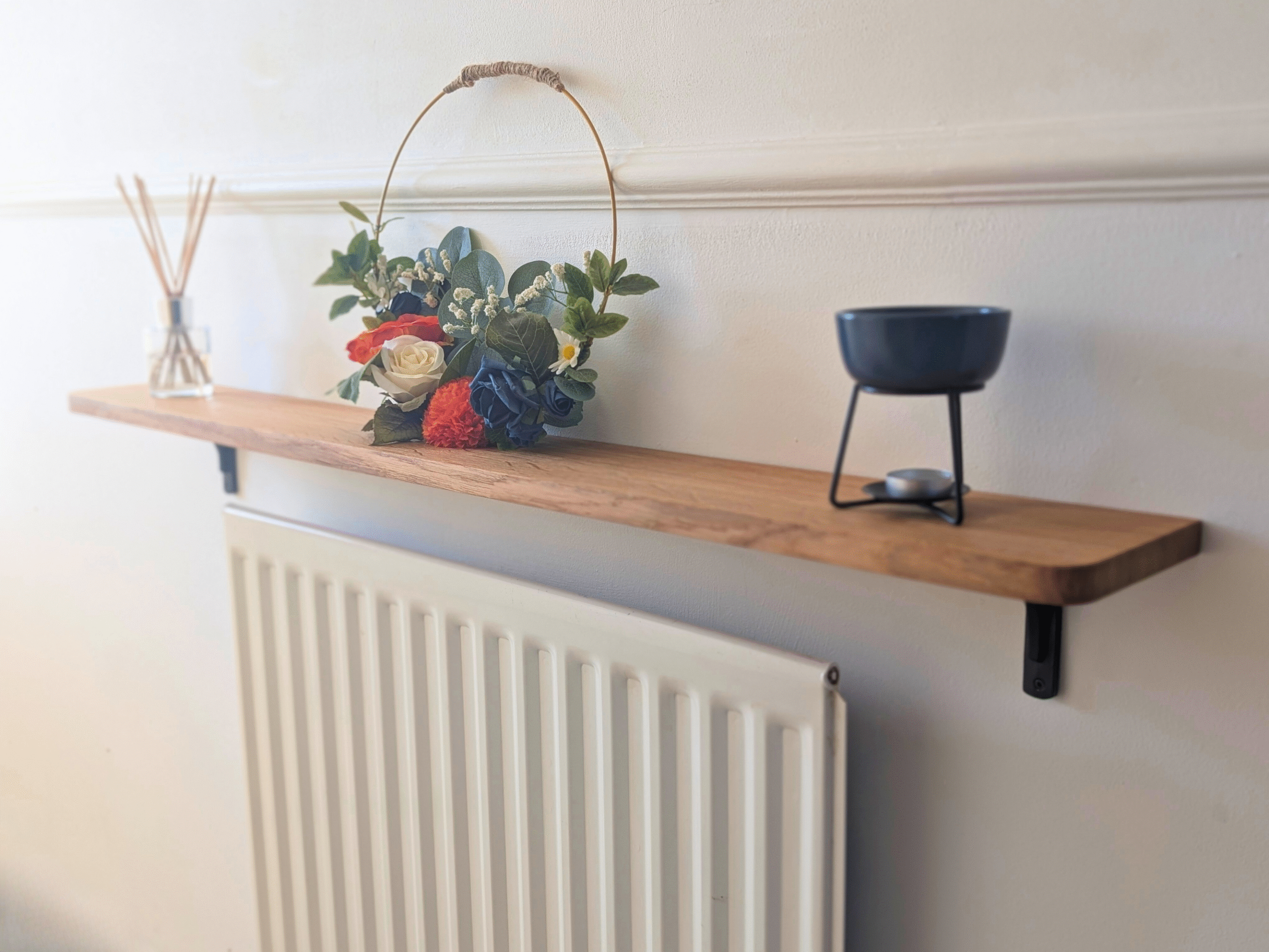 Oak radiator shelf with cast iron brackets