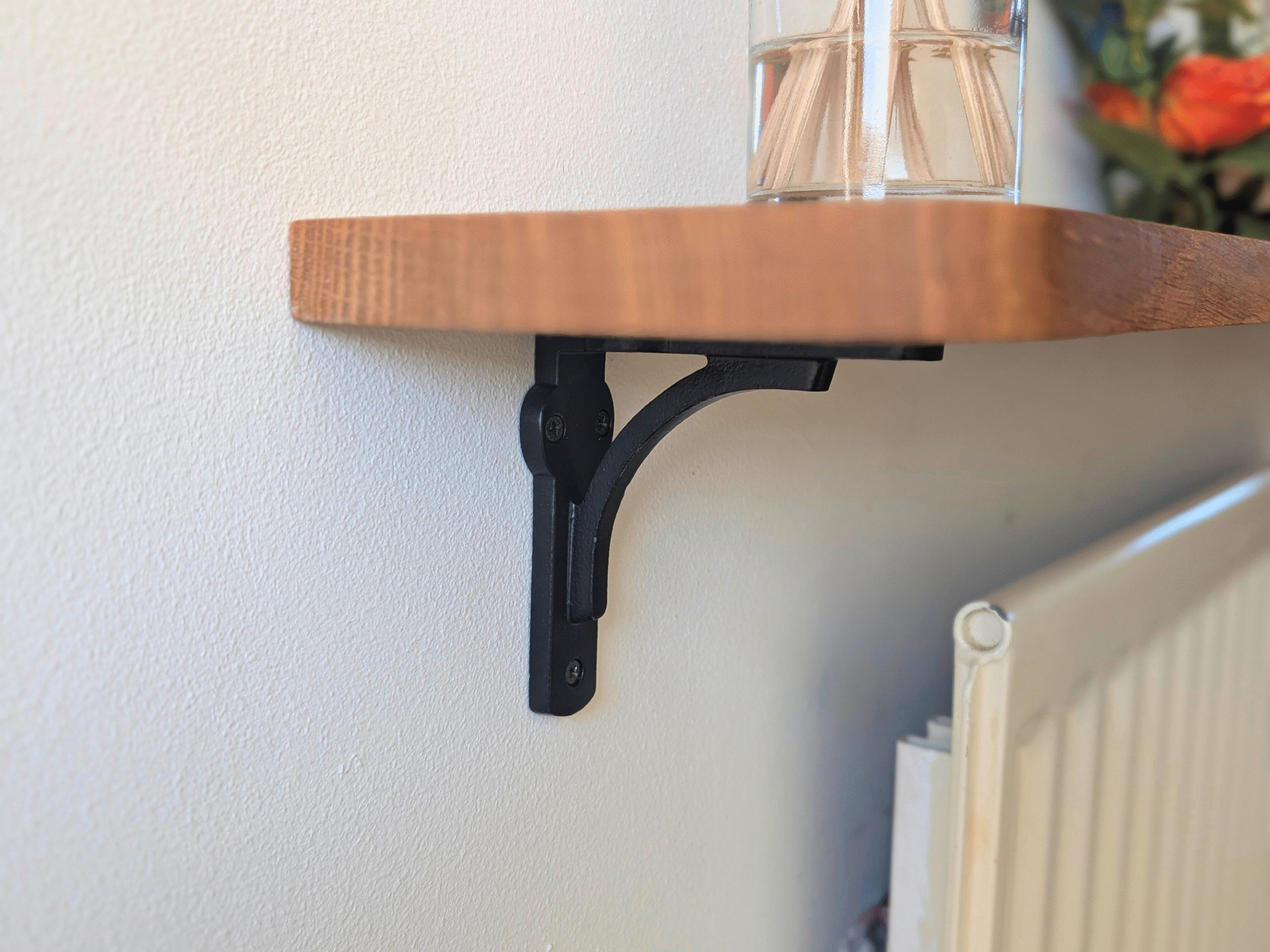 Oak radiator shelf with cast iron brackets
