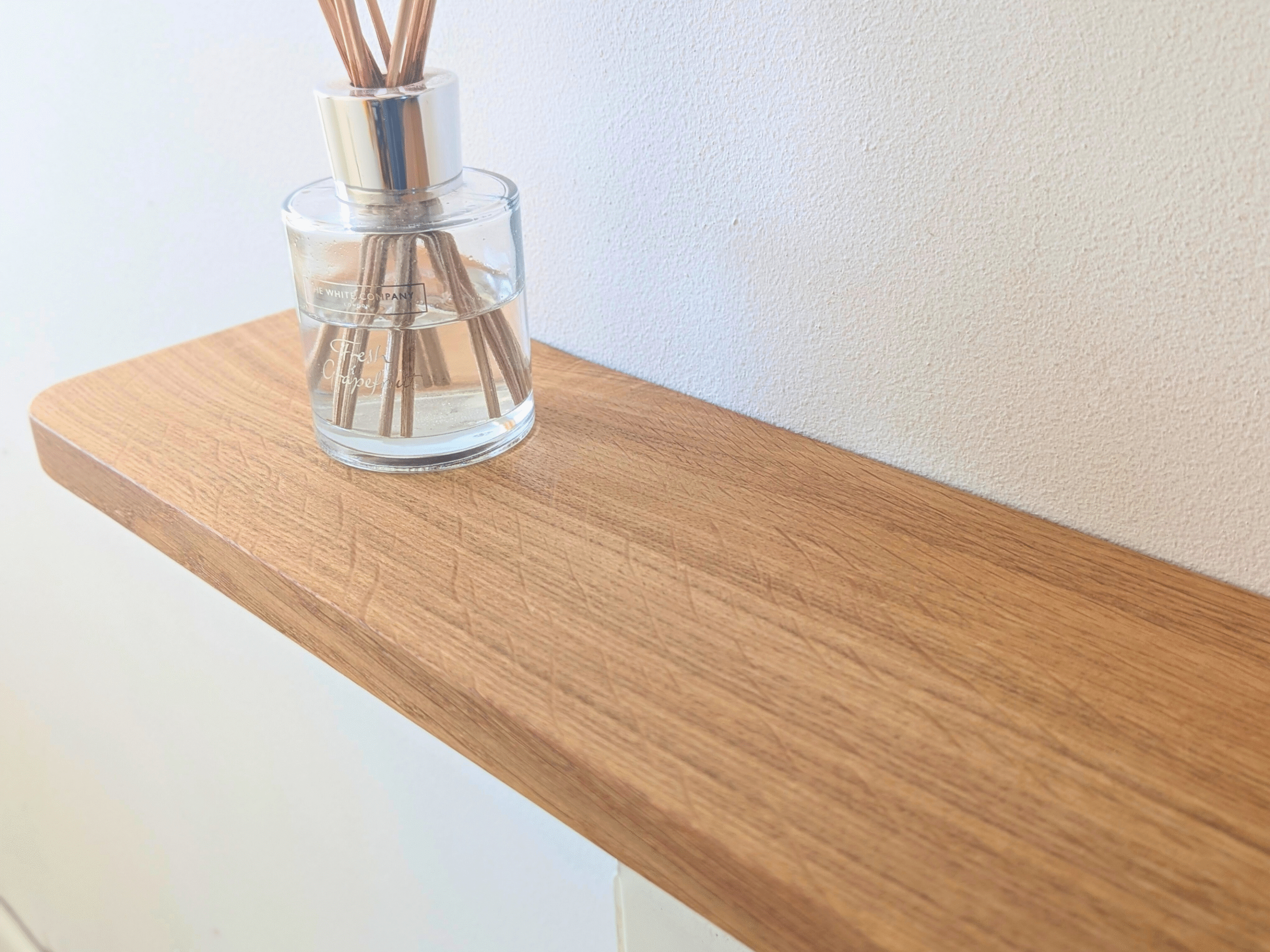 Oak radiator shelf with cast iron brackets