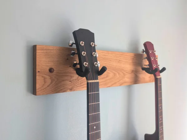 Solid Oak Double Guitar Wall mount with 2 guitars - close angled image