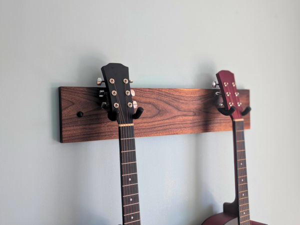 Solid Black Walnut Double Guitar Wall Mount - angled image