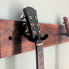 Solid Black Walnut Double Guitar Wall Mount - closeup angled image