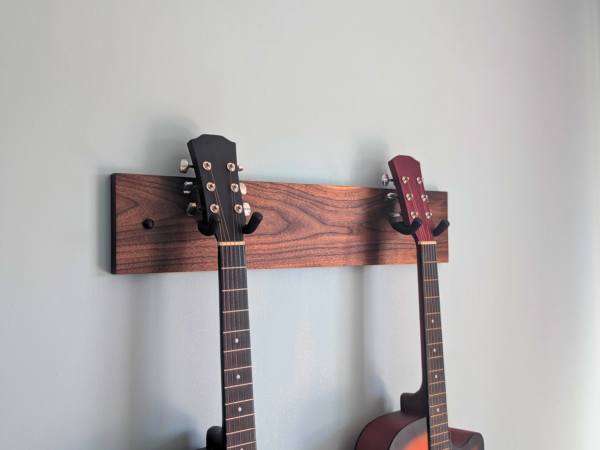 Solid Black Walnut Double Guitar Wall Mount - angled image