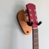 Solid Oak Plectrum Guitar Mount - closeup angled image with guitar