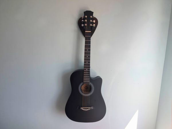 Solid Black Walnut Plectrum Guitar Mount - with guitar, straight image