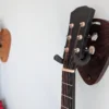 Solid Oak Plectrum Guitar Mount - with walnut version and guitars, angled
