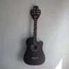Solid Black Walnut Plectrum Guitar Mount - with guitar, straight image