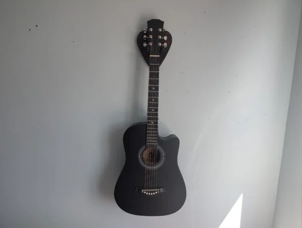 Solid Black Walnut Plectrum Guitar Mount - with guitar, straight image