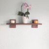 Modern Solid Black Walnut Scandi Floating Shelf - straight image with candles and orchid